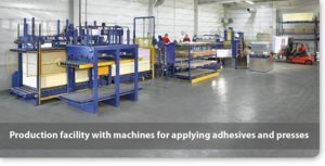 Production of composite panels - Production facility with machines for applying adhesives and presses